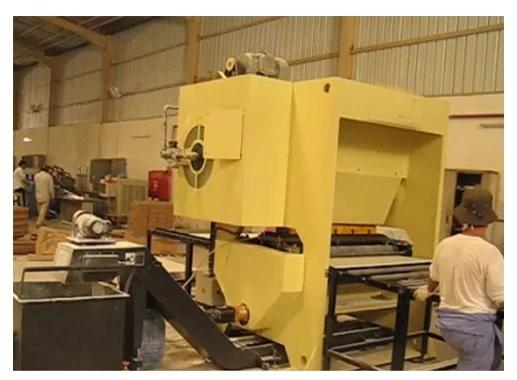 Industrial gypsum board punching machine in operation Industrial gypsum board punching machine in operation